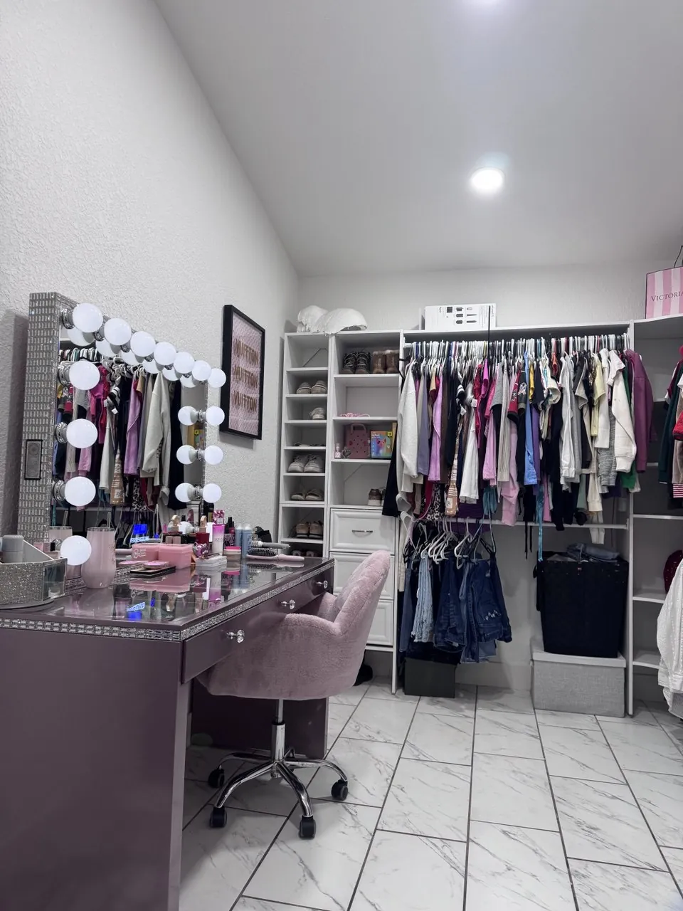 Walk-in closet and vanity after cleaning by Lilly Maids