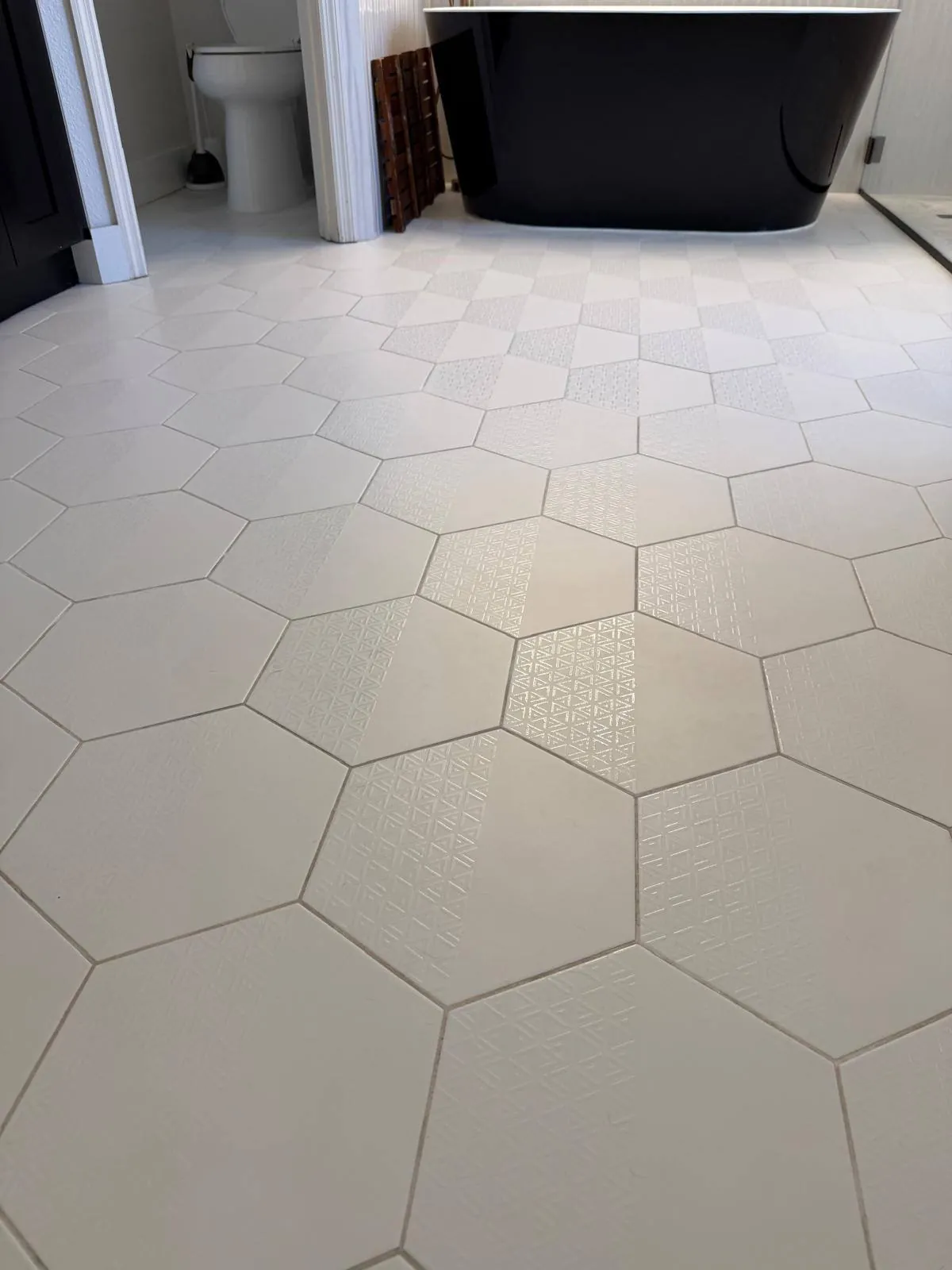 Bathroom hex tile floor after cleaning by Lilly Maids